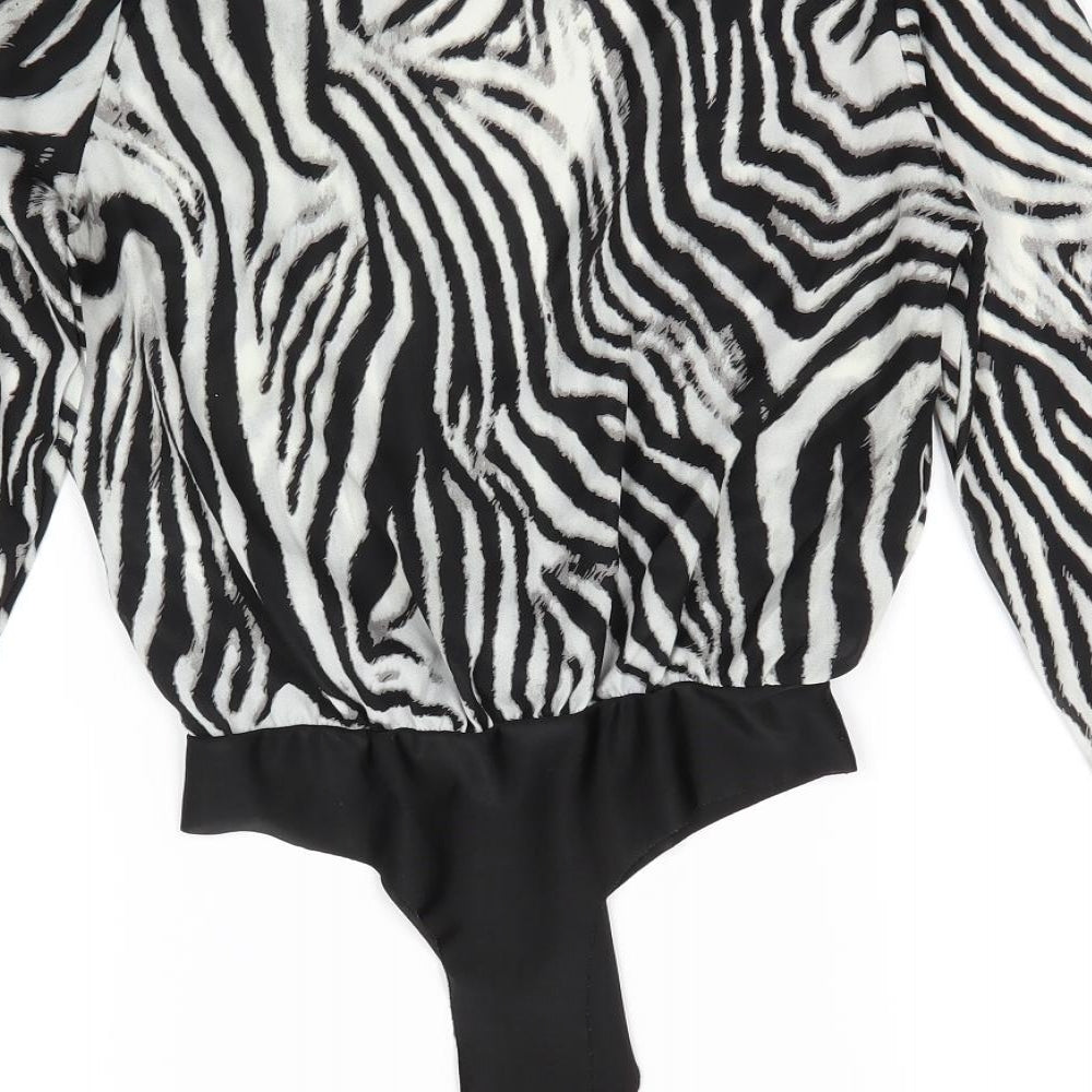Brand and care label for Naanaa women’s black striped polyester bodysuit one-piece, size UK 8