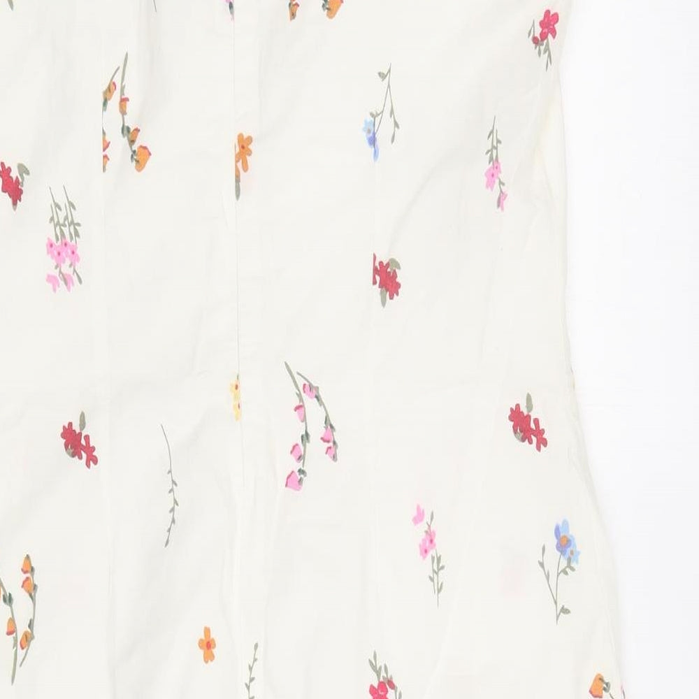 Brand and care label for women’s white floral cotton shift, size UK 10, round neck zip