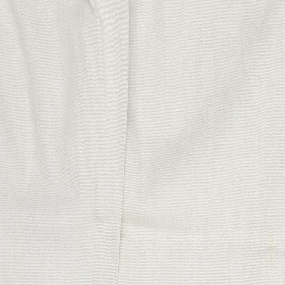 Brand and care label for River Island women’s beige cotton tapered jeans, size UK 10, 30-inch leg regular zip