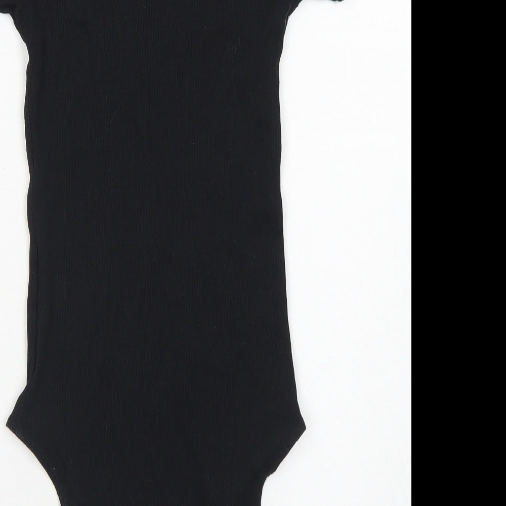 Brand and care label for Divided women’s black cotton bodysuit one-piece, size S, snap - lettuce edging