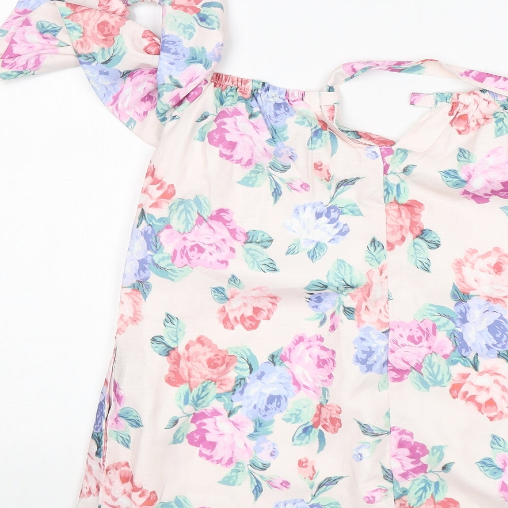 Brand and care label for In the Style women’s multicoloured floral polyester playsuit one-piece, size UK 8