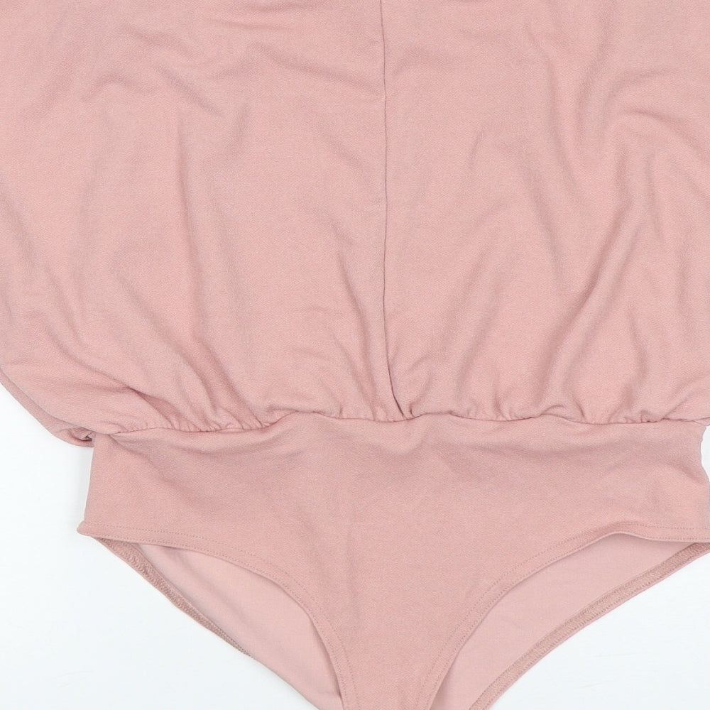 Brand and care label for Boohoo women’s pink polyester bodysuit one-piece, size UK 12