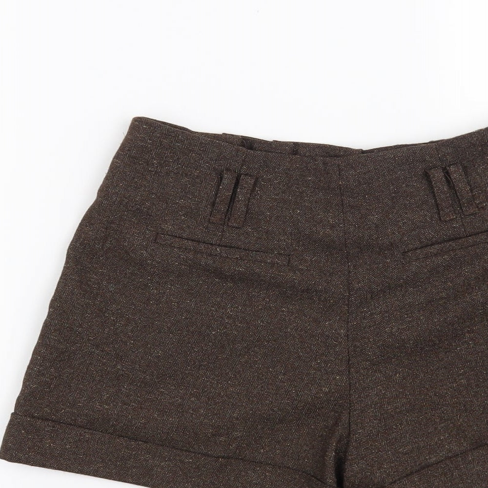 Brand and care label for Forever 21 women’s brown polyester hot pants shorts, size XS, 4-inch leg regular