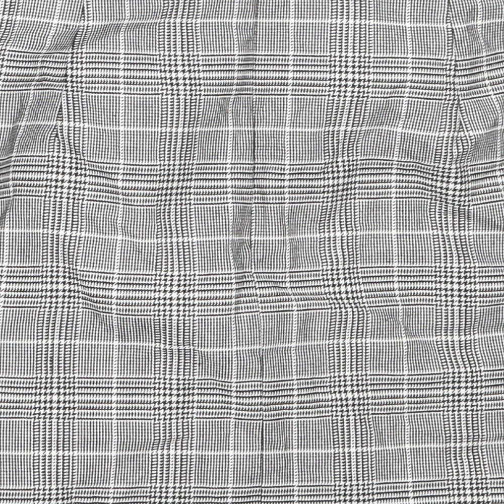 Brand and care label for H&M women’s grey polyester mini skirt, size UK 38
