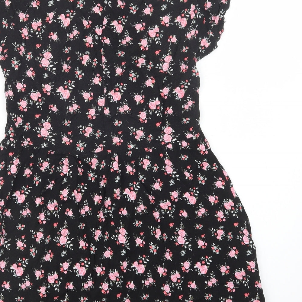 Brand and care label for H&M women’s black floral viscose fit & flare, size UK 4, crew neck