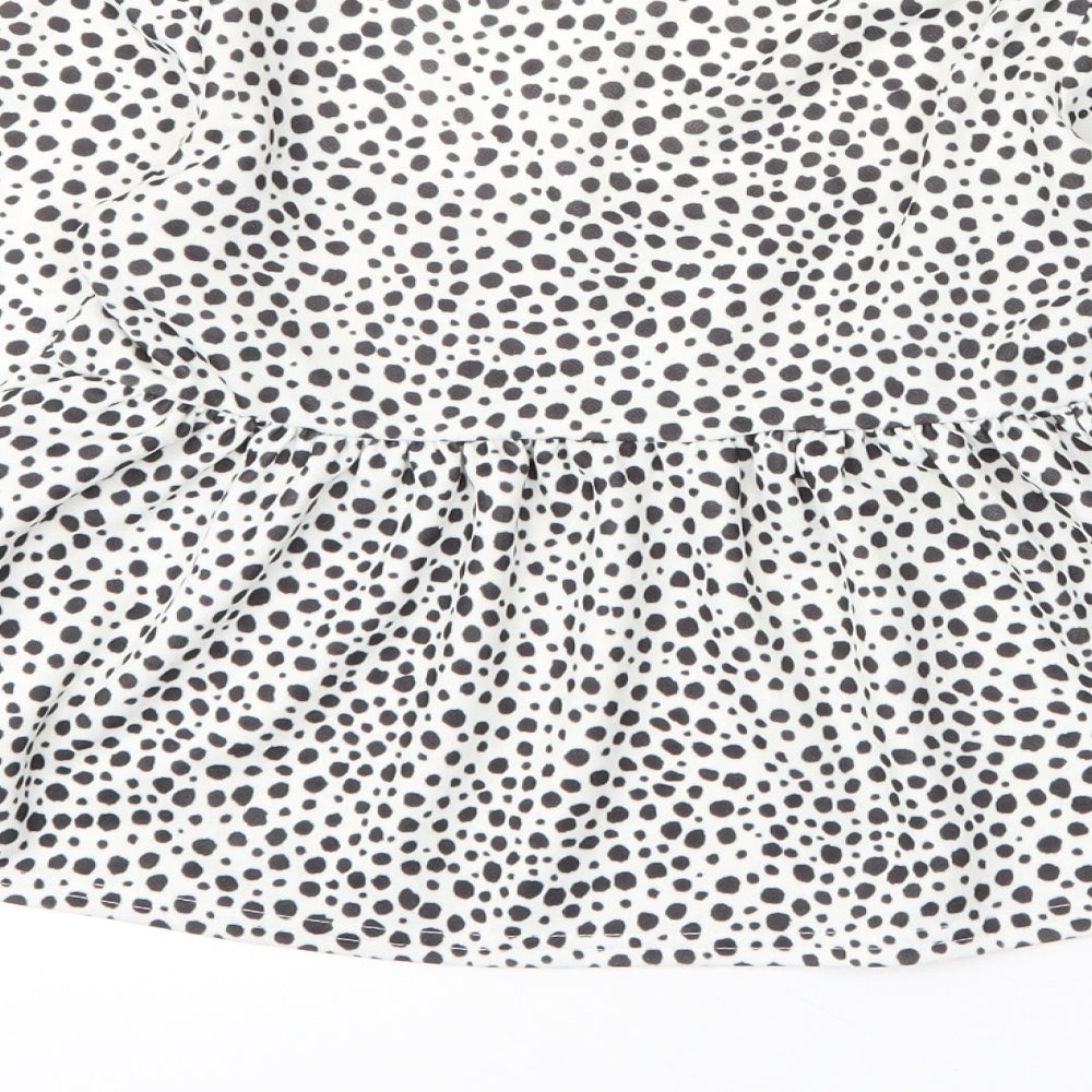 Brand and care label for I SAW IT FIRST women’s white animal print polyester cropped blouse, square neck - leopard print