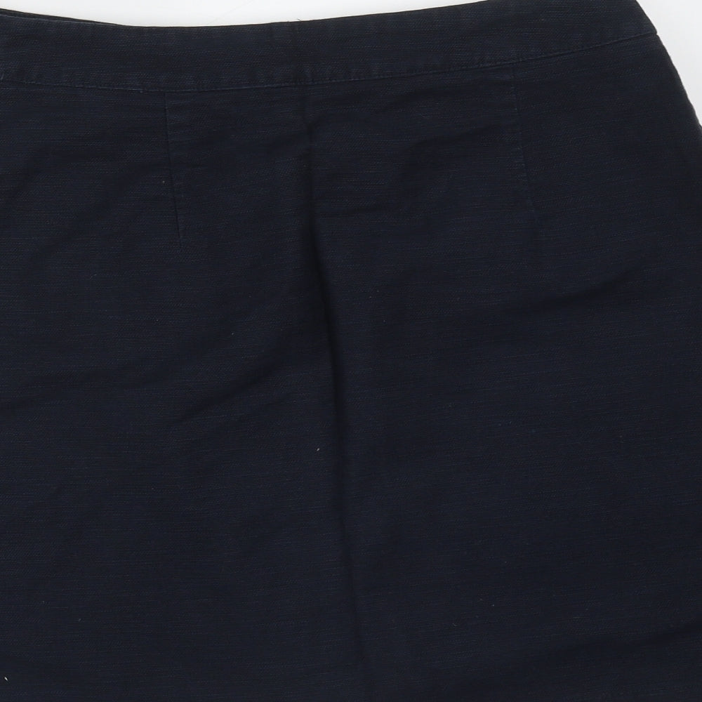 Brand and care label for Papaya women’s blue cotton mini skirt, size UK 8, button