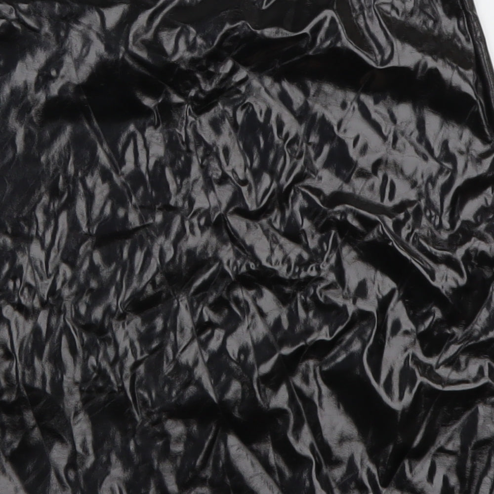 Brand and care label for PRETTYLITTLETHING women’s black polyester a-line skirt, size UK 10