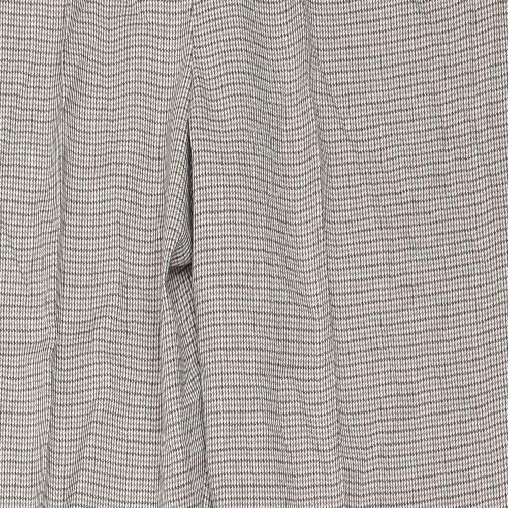 Brand and care label for F&F women’s beige polyester trousers, size UK 14, 27-inch leg regular