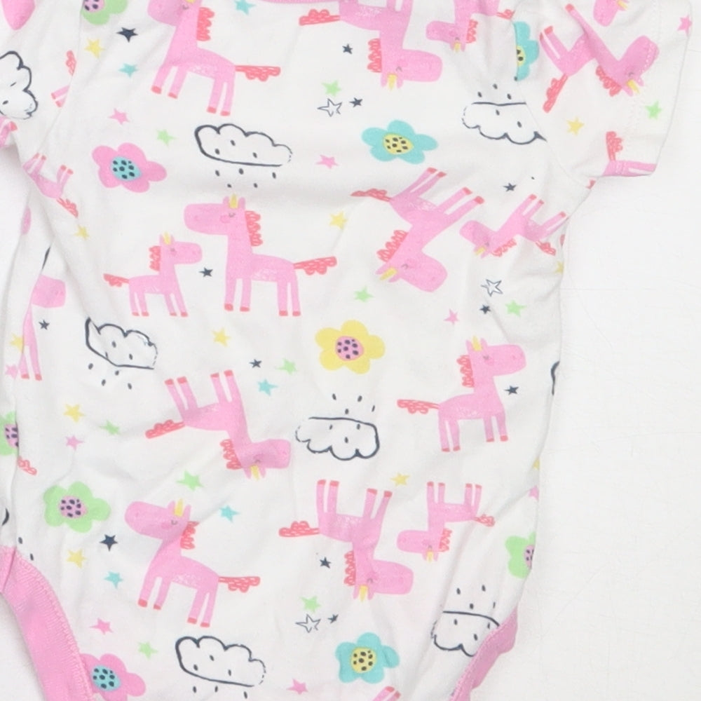 Brand and care label for Dunnes Stores girls’ white cotton babygrow one-piece, size 3-6, months