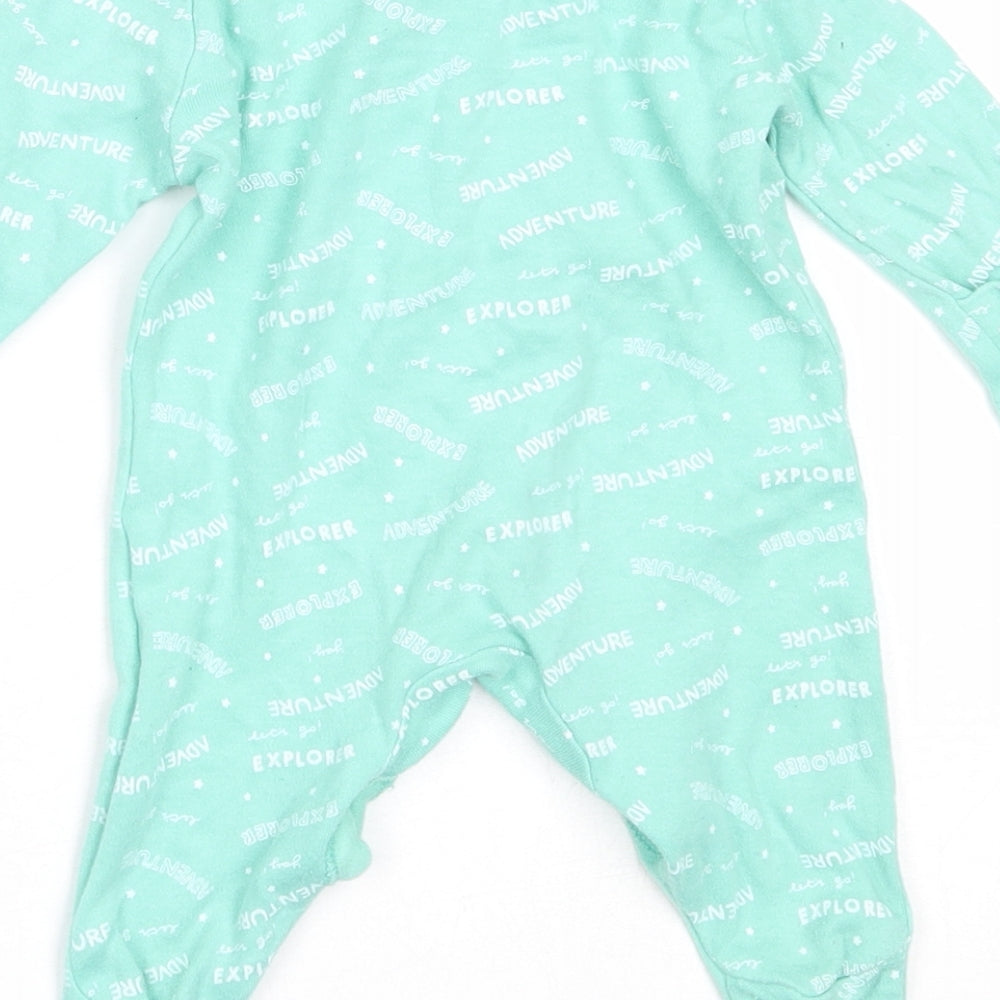 Brand and care label for Primark boys’ green cotton babygrow one-piece size newborn