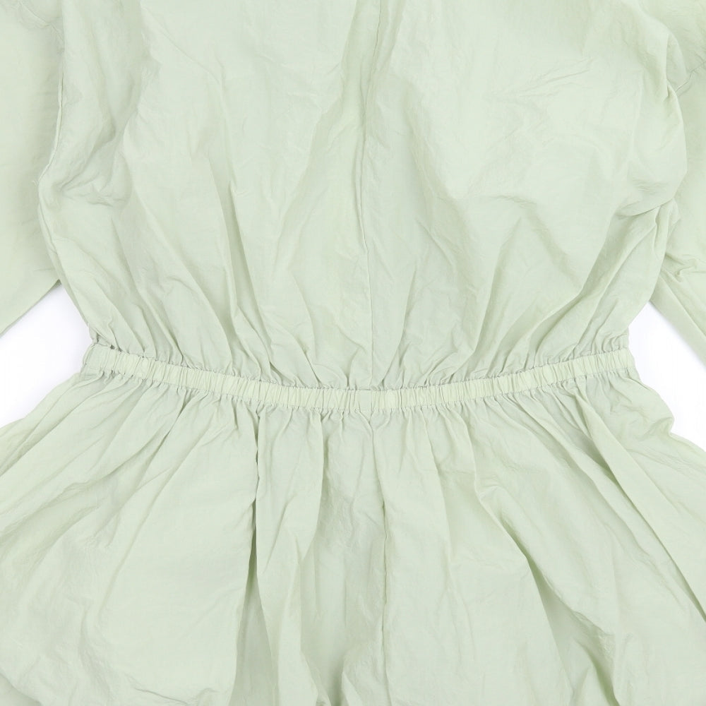 Brand and care label for Missguided women’s green jacket, size UK 12, zip