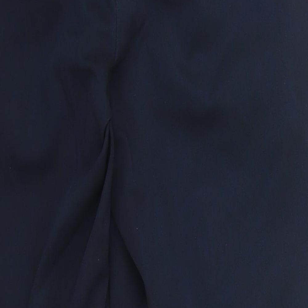 Brand and care label for Next men’s blue polyester trousers, size 30, 28-inch leg regular button