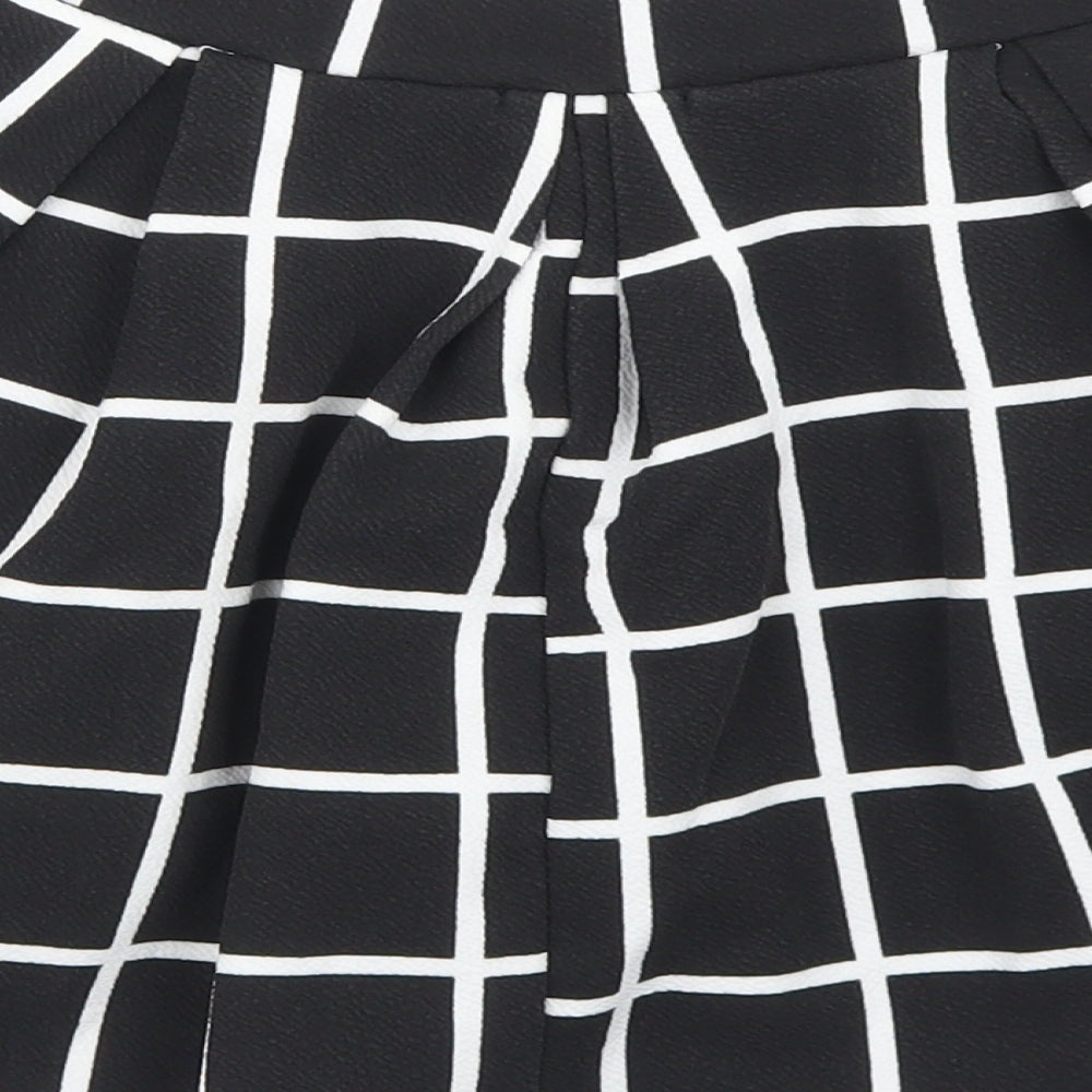 Brand and care label for Boohoo women’s black check polyester pleated skirt, size UK 10