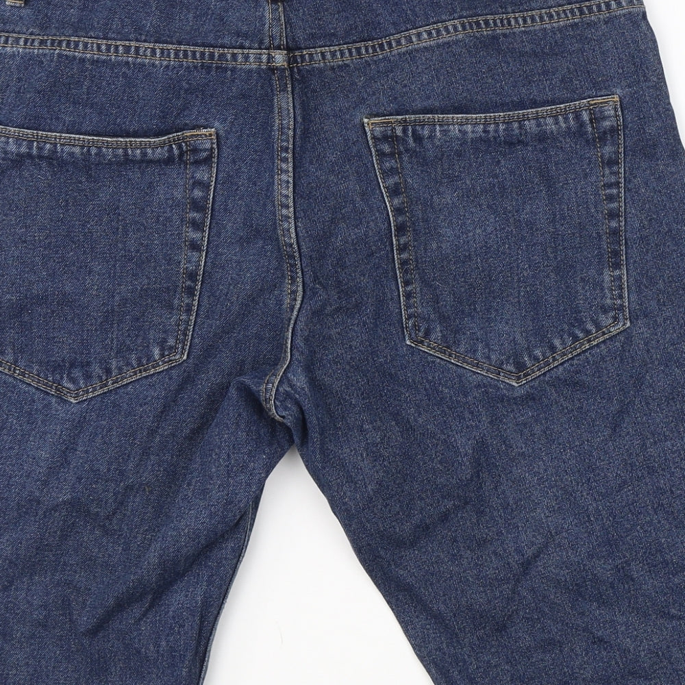 Brand and care label for ACW 85 men’s blue cotton boyfriend jeans, size 32, in regular button