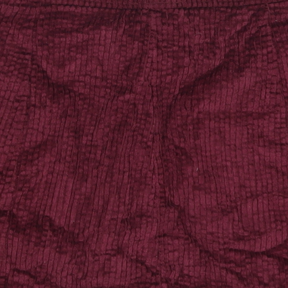Brand and care label for Cameo Rose women’s purple cotton a-line skirt, size UK 28, in button
