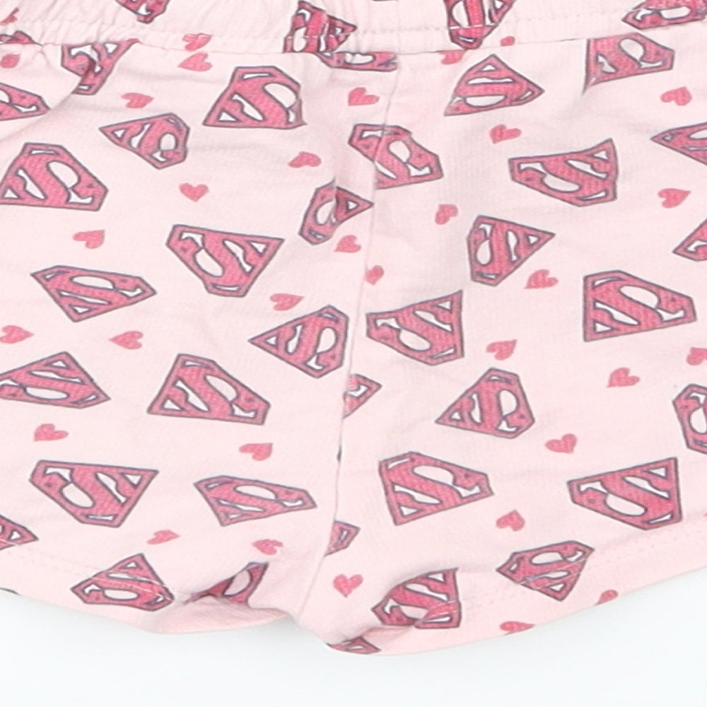 Brand and care label for Supergirl girls’ pink geometric cotton sweat shorts, size 6-7, years regular drawstring