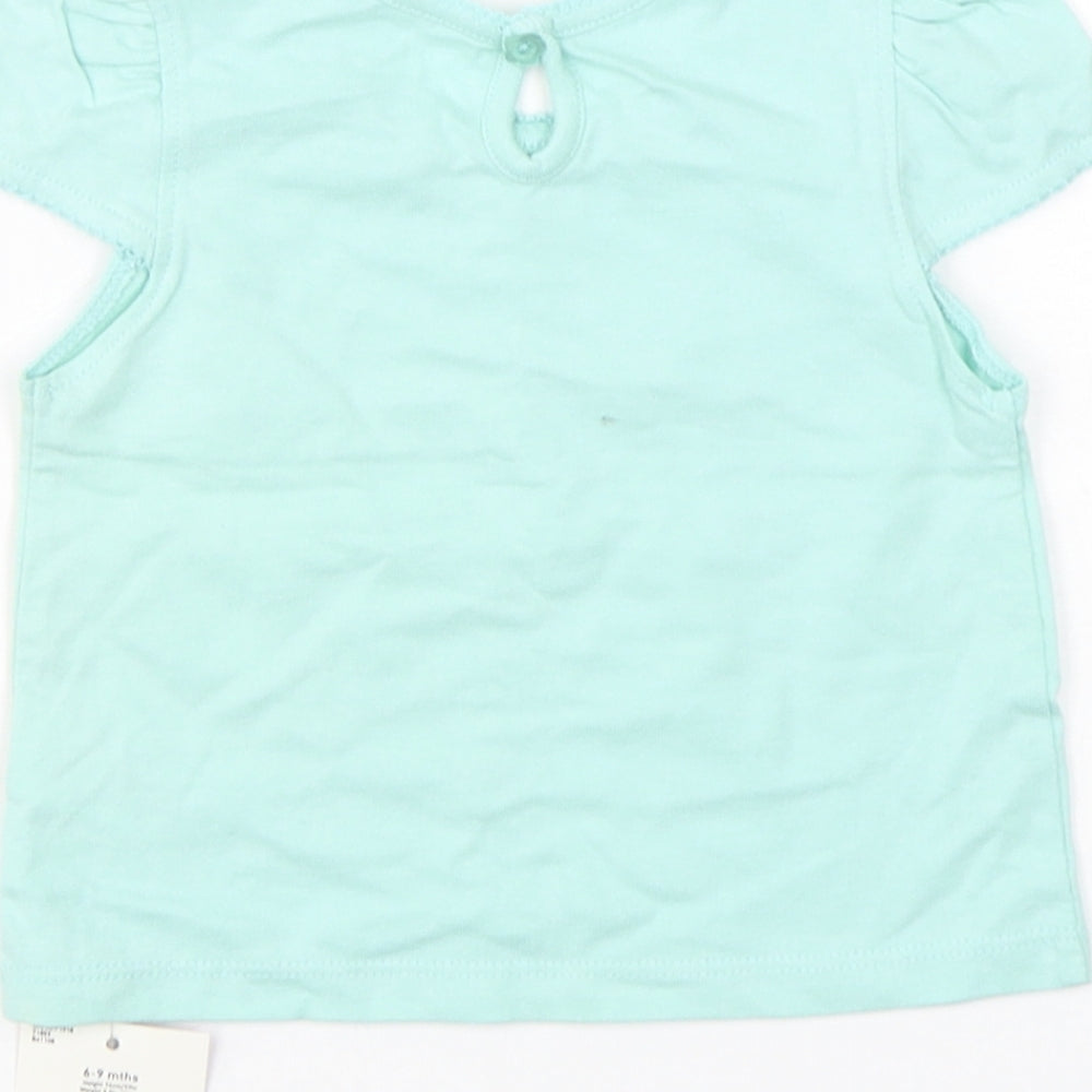 Brand and care label for Cherokee girls’ green cotton basic t-shirt, size 6-9, months round neck pullover