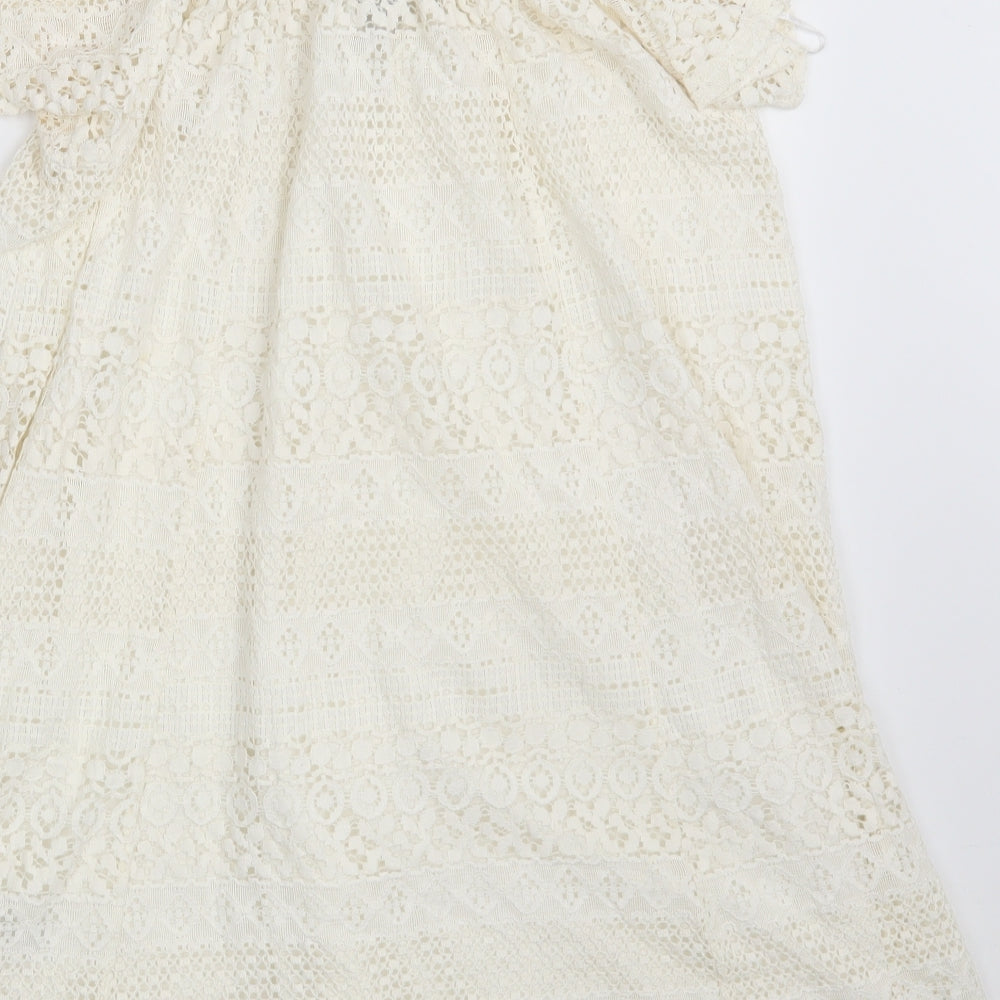 Brand and care label for Topshop women’s ivory floral cotton a-line, size UK 6, boat neck
