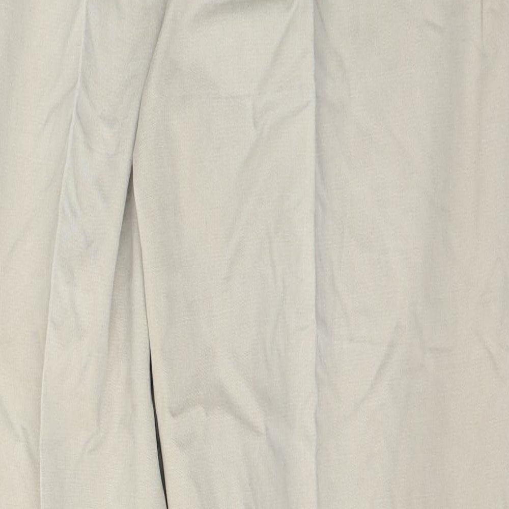 Brand and care label for Dunnes men’s beige cotton trousers, size XL, 33-inch leg regular button