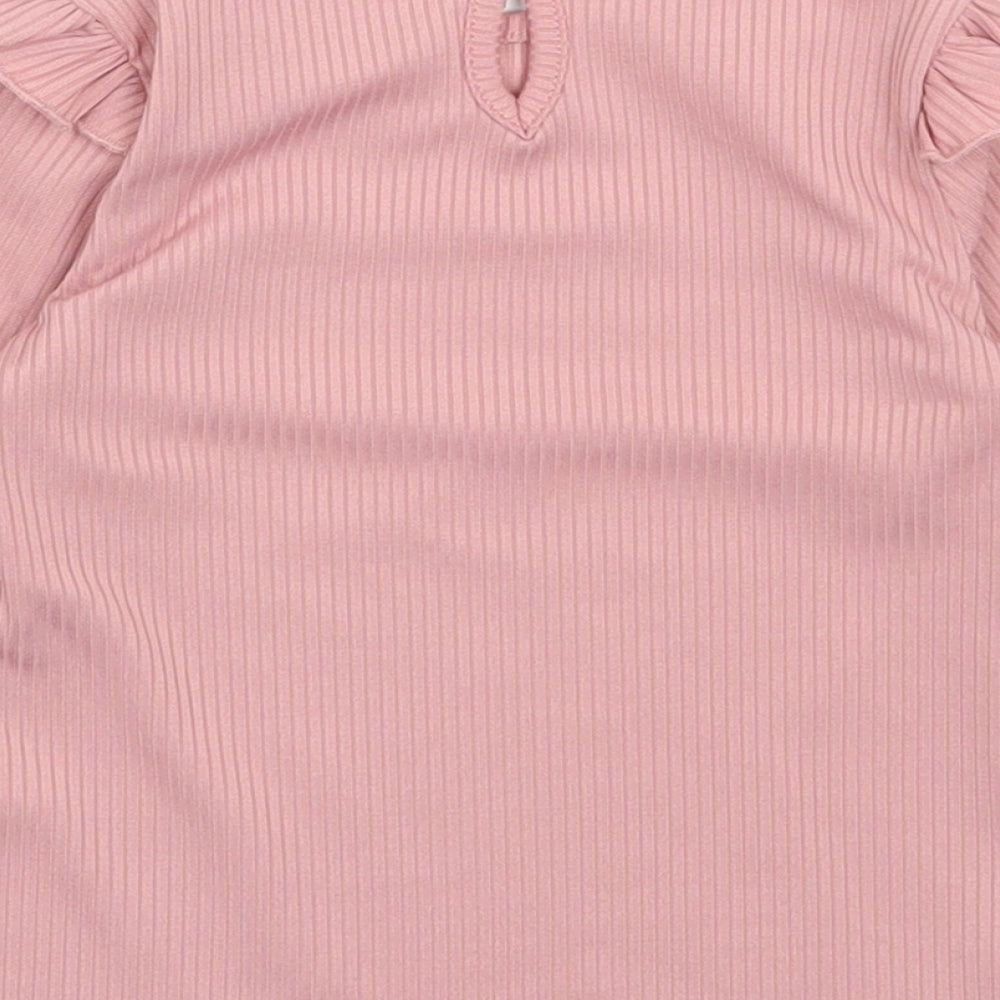Brand and care label for Primark girls’ pink polyester pullover casual, size 9-12, months round neck pullover