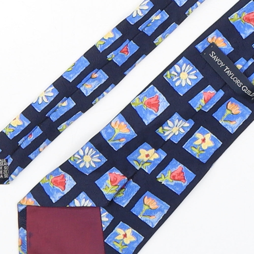 Brand and care label for Savoy Taylors Guild men’s blue floral silk pointed tie one size