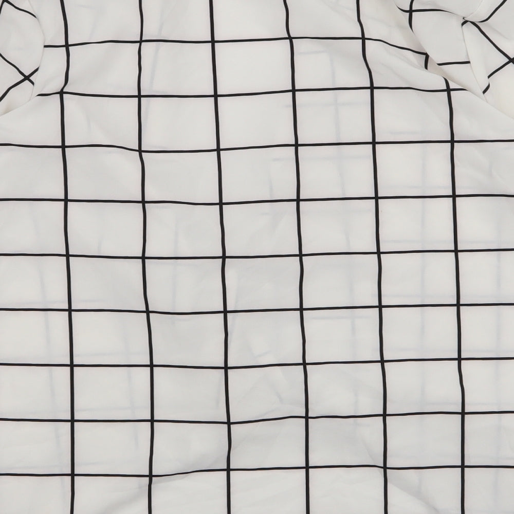 Brand and care label for SHEIN women’s white plaid jacket, size M