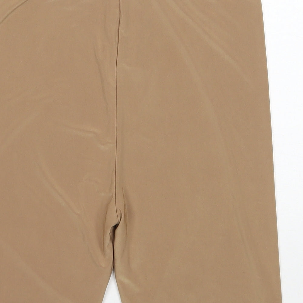 Brand and care label for PRETTYLITTLETHING women’s brown polyester biker shorts, size UK 10, 7-inch leg regular