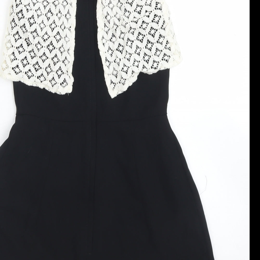 Brand and care label for Miss Selfridge women’s black polyester playsuit one-piece, size UK 6, zip - lace overlay