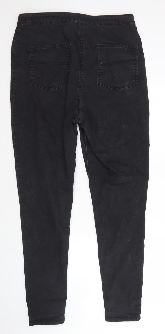 Back view of Collusion women’s black cotton skinny jeans, size UK 36, in, 30-inch leg regular button