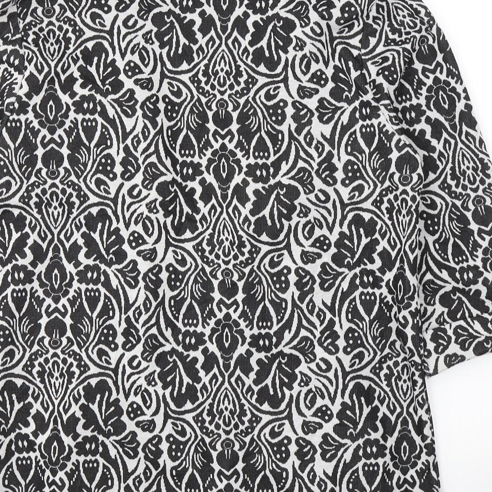 Brand and care label for Tu women’s black v-neck floral polyester cardigan jumper, size UK 14