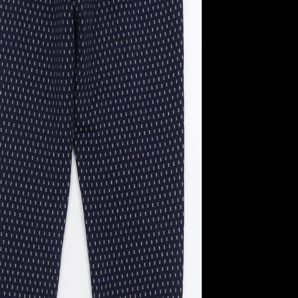 Brand and care label for F&F women’s blue geometric polyester trousers, size UK 8, 26-inch leg regular
