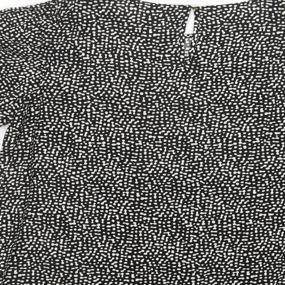 Brand and care label for F&F women’s black animal print viscose basic blouse, size UK 12, boat neck