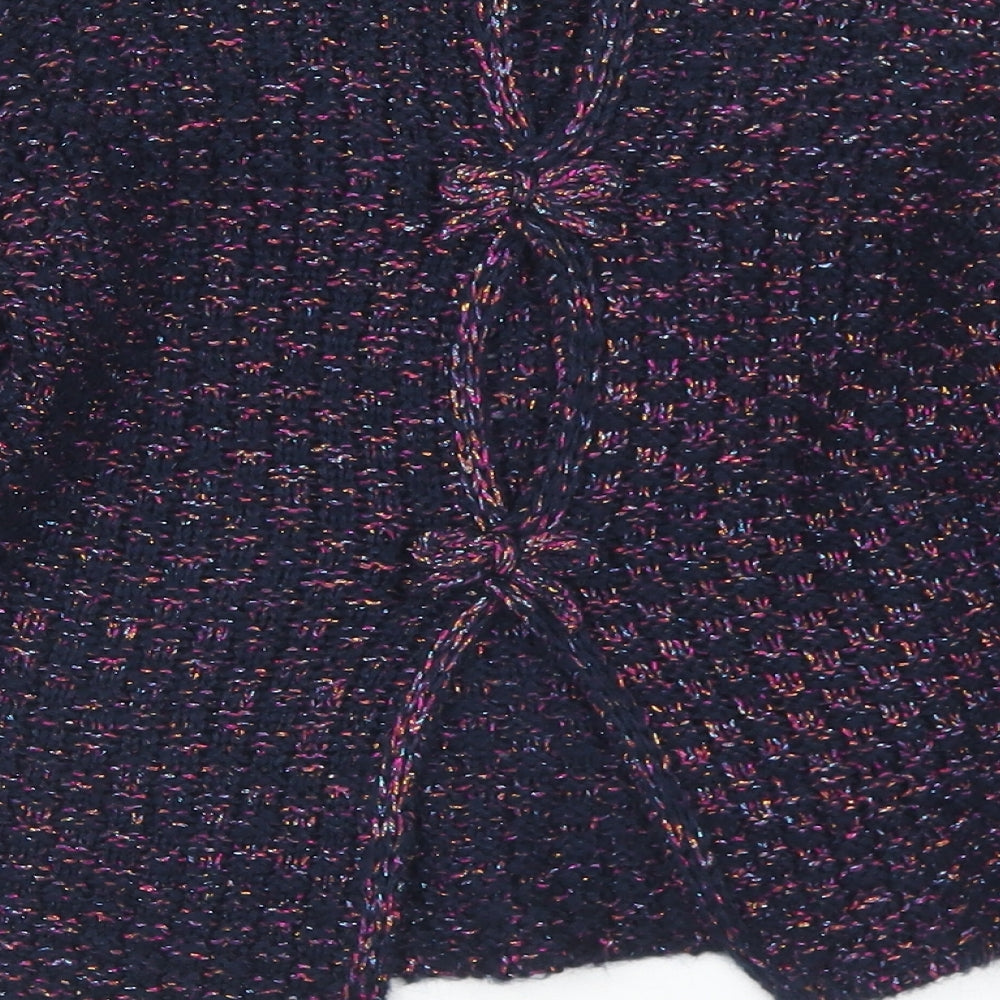 Brand and care label for Dunnes girls’ blue round neck acrylic jumper, size 8, years