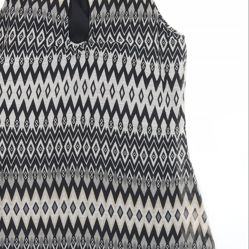 Brand and care label for E-vie women’s black argyle/diamond polyester basic blouse, size UK 12, round neck