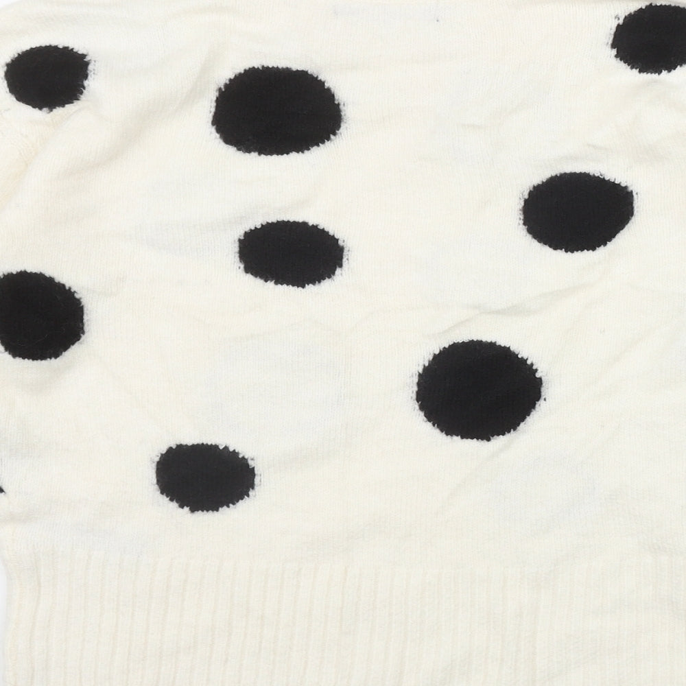 Brand and care label for Marks & Spencer women’s ivory round neck polka dot acrylic jumper, size XS