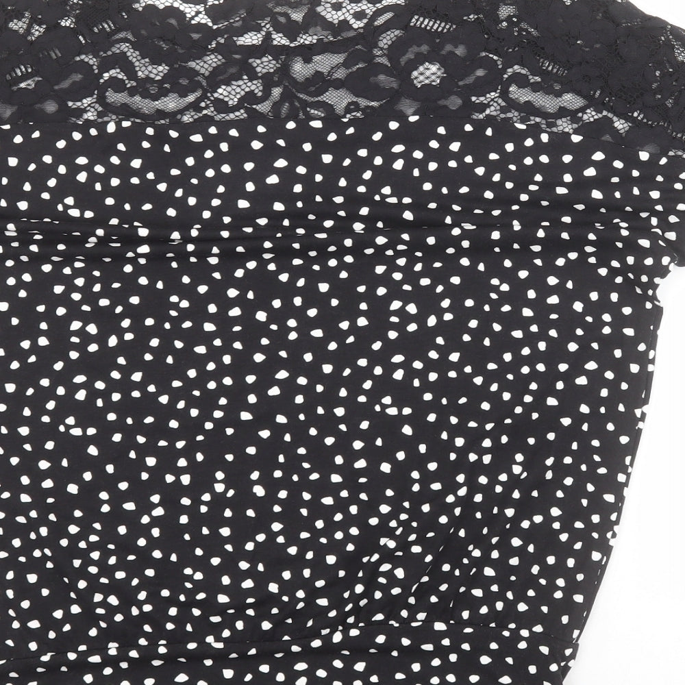 Brand and care label for F&F women’s black polka dot viscose basic t-shirt, size UK 8, round neck