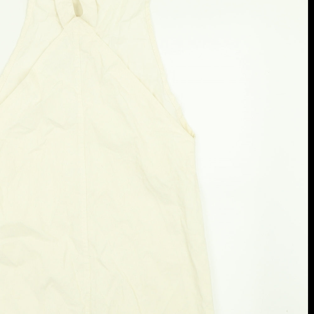 Brand and care label for Boohoo women’s ivory cotton pinafore/dungaree dress, size UK 10, square neck button