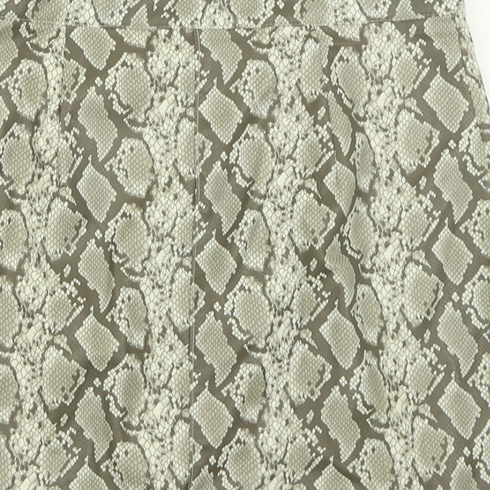 Brand and care label for H&M women’s brown animal print polyester a-line skirt, size UK 10, zip