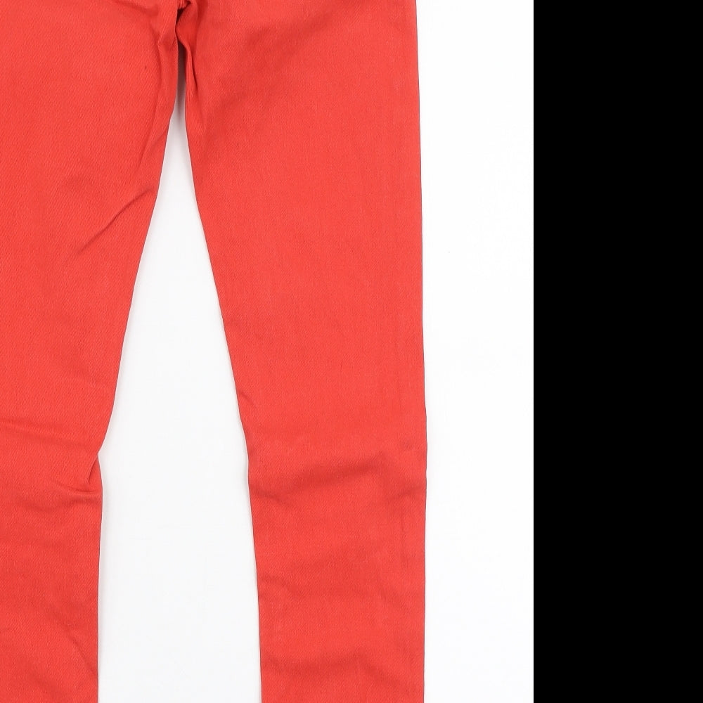 Brand and care label for Topshop women’s red cotton skinny jeans, size UK 28, in, 28-inch leg slim zip