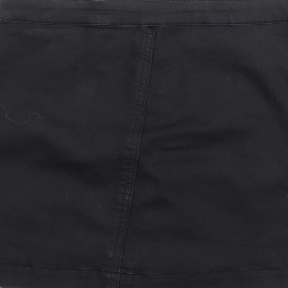 Brand and care label for PRETTYLITTLETHING women’s black polyester a-line skirt, size UK 10