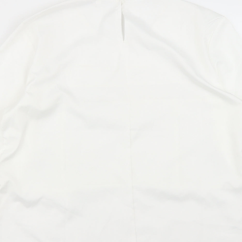 Brand and care label for Preworn women’s white polyester basic blouse, size M, roll neck