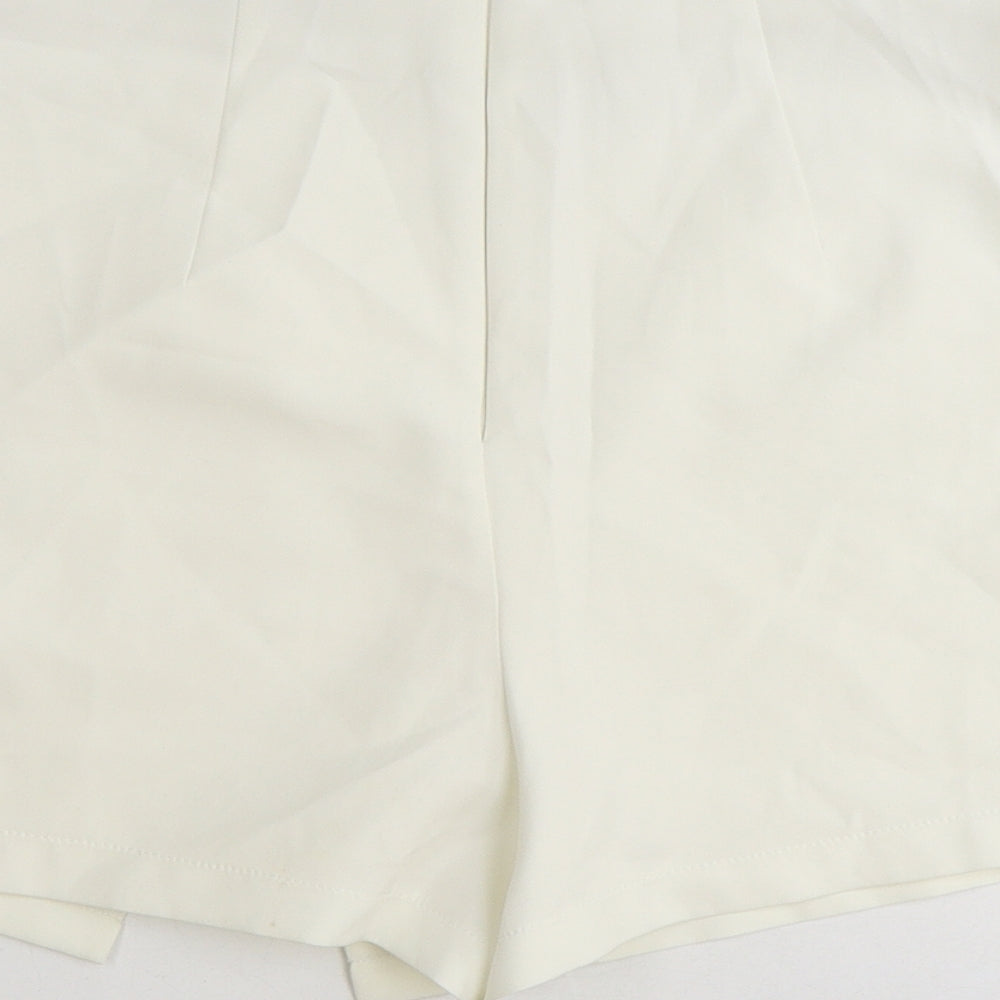Brand and care label for ASOS women’s white polyester skort, size UK 6, regular zip
