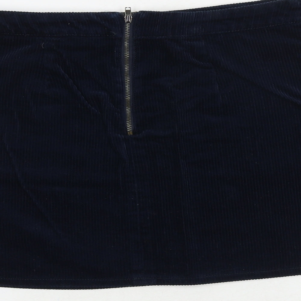 Brand and care label for BDG women’s blue cotton mini skirt, size S, zip