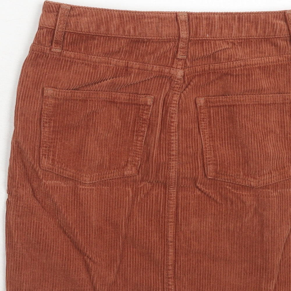 Brand and care label for BDG women’s brown cotton a-line skirt, size XS, zip