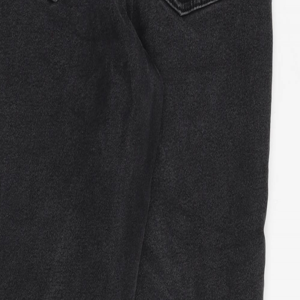 Brand and care label for ASOS women’s black cotton tapered jeans, size UK 26, in, 28-inch leg regular zip