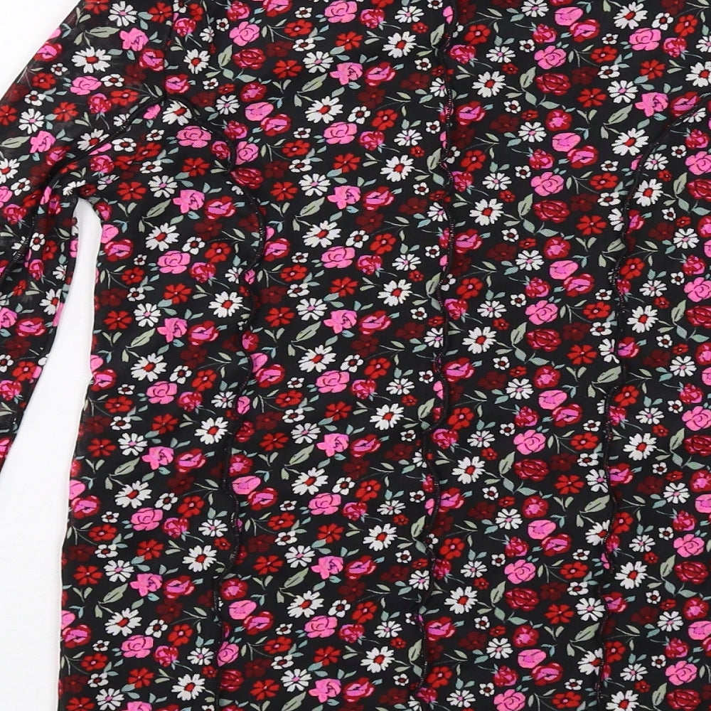 Brand and care label for Marks & Spencer girls’ black floral polyester basic t-shirt, size 10-11, years mock neck pullover