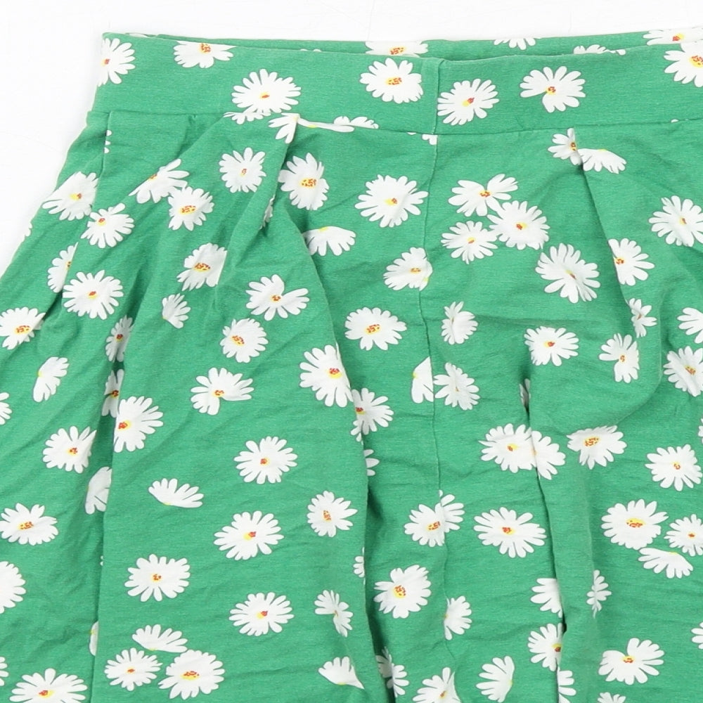 Brand and care label for ASOS women’s green floral viscose skater skirt, size UK 10