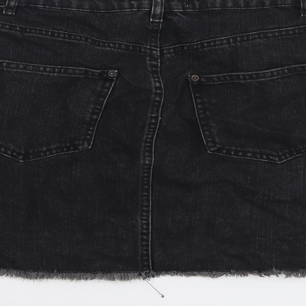 Brand and care label for Miss Selfridge women’s grey cotton a-line skirt, size UK 10, button