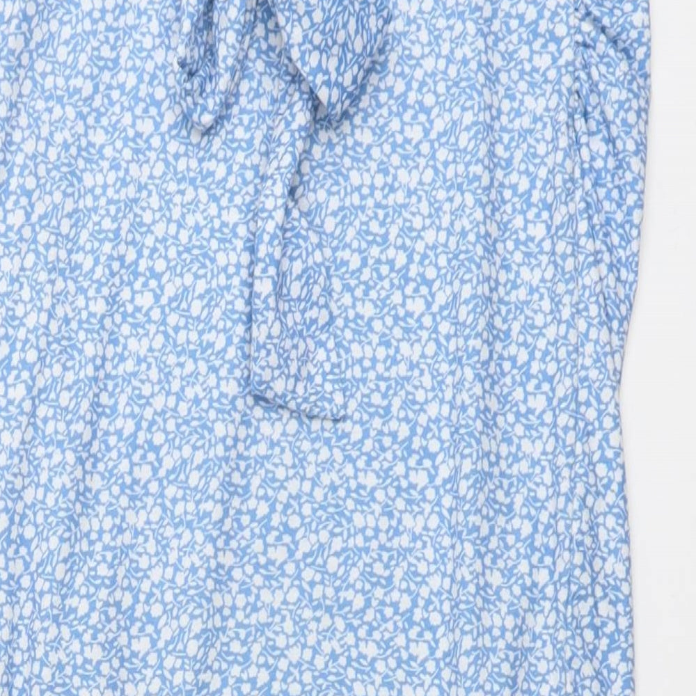Brand and care label for In the Style women’s blue floral polyester a-line skirt, size UK 8